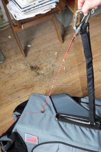 Haul-up chord attached to harness
