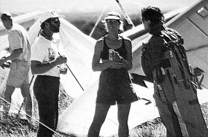 Art based on a photo by Jay Blackwood of Larry Tudor, Kari Castle, and Chris Arai after landing at Santa Fe in the 1994 Sandia Classic