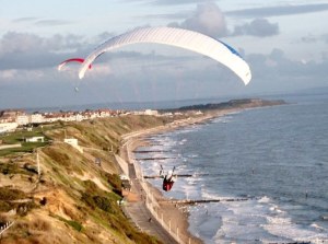 Aerial photo of paragliders flying the Bournemouth cliffs