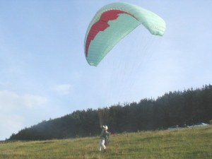Photo of a paraglider about to launch