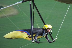 Close-up of hang glider pilot flying at Mere, Wiltshire, England, in June 2020
