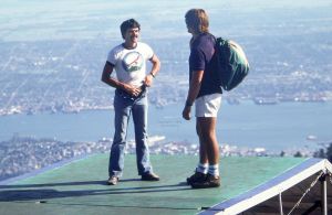 Barry Batman and another hang glider pilot converse on the launch ramp at Grouse Mountain in 1984. Photo by Jan Kulhavy.