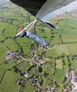 Wills Wing U-2 hang glider over a village in north Dorset in 2015