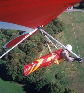Hang glider setting up for a landing near the mansion below Kimmeridge, Dorset, England, in 2005