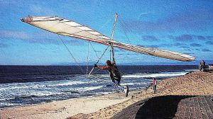 Steve Morris launching in a hang glider at Marina Beach, California. Photo by Geoff Phipps.