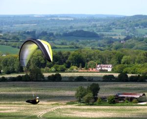 Paraglider flying at Monk's Down, England, in May 2015