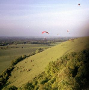 Paragliders and a balloon at Combe Gibbet, Berkshire, England, in May or June, 2004