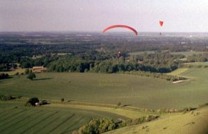 Combe Gibbet, Berkshire, England, in June 2004 taken with a hand-held compact 35mm film camera aboard a paraglider
