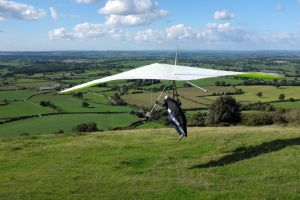 Tony Woodley launches in an Avian Rio hang glider at Bell Hill, north Dorset, UK