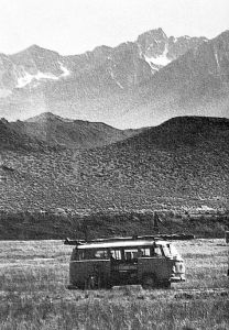 VW bus with hang glider on the roof in the Owens Valley